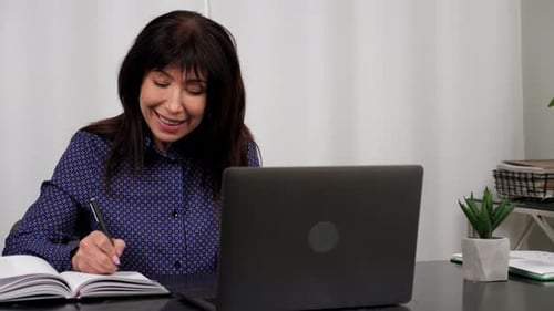 Company Manager Listens Businesswoman Online Video Call Webcam Laptop in Office