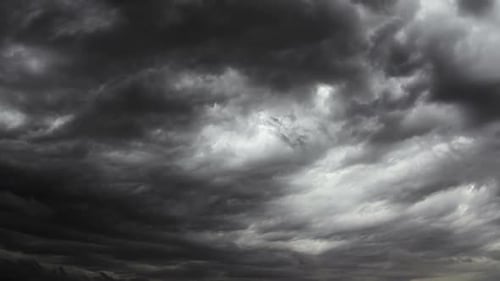 Cloudscape time lapse. Gray and blue. 2 videos in one file. Clouds passing by. No flicker.