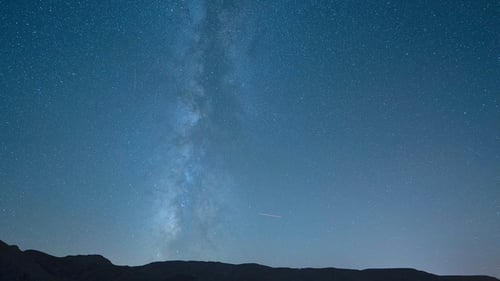 Time lapse of a starry night sky clouds