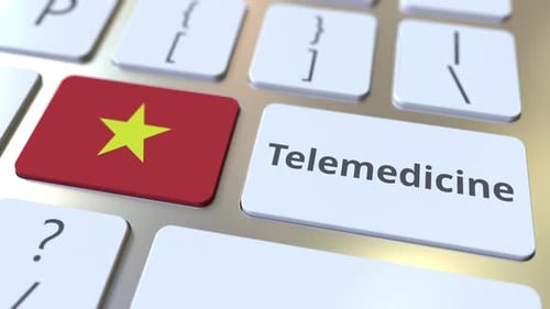 Telemedicine Word and Vietnam Flag on Computer Keyboard