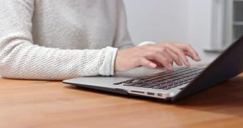 Woman type on computer