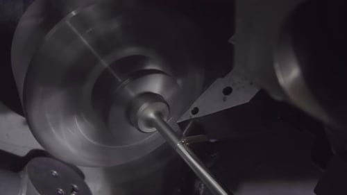 Industrial machine cutting and crafting cylindrical metal