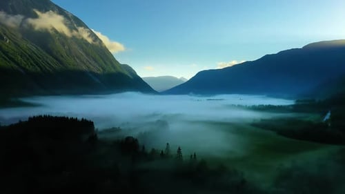 Morning Mist Over the Valley Among the Mountains in the Sunlight