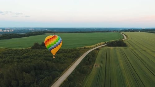Hot Air Balloon in the Sky Over a Field