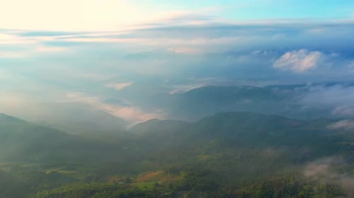4K Drone Flying in the clouds. Flying through the clouds during sunrise