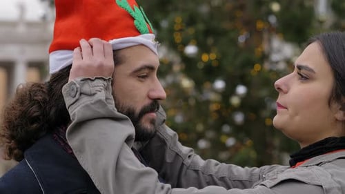 Couple Celebrate Christmas with Festive Holiday Hat
