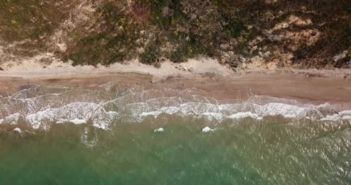 Top Down View of Waves Breaking in the Sand, Flying Over Tropical Sandy Beach and Waves