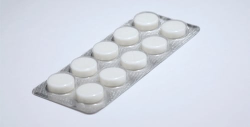 White Pills in Dosage Spinning