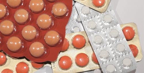 Macro Pills Moving on a White Background