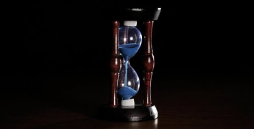 Sand Clock on Black Background