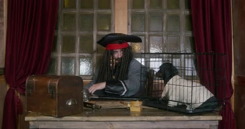 Pirate with Dreadlocks at Wooden Desk