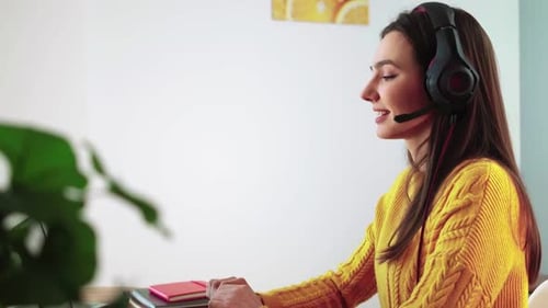 Woman Attends Virtual Meeting with Headset