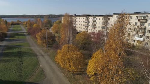 Aerial view of provincial city with soviet panel houses and the alley 29
