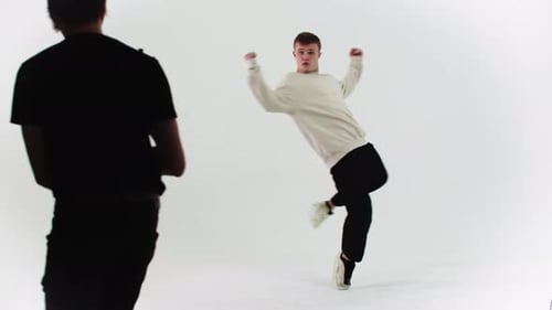 Young Adult Dancing in a White Studio