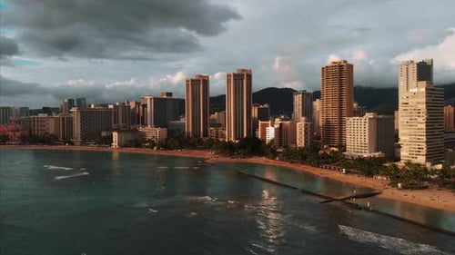 Aerial drone footage of Honolulu, Hawaii.
Beautiful real estate, buildings in the city.
Palm trees