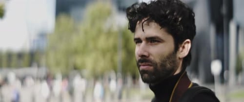 Man Takes Pictures in Urban Environment