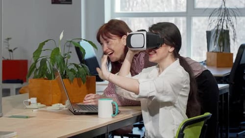 Women Experiencing Virtual Reality in Office Setting