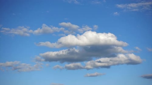 Clouds Moving Across Vibrant Blue Sky
