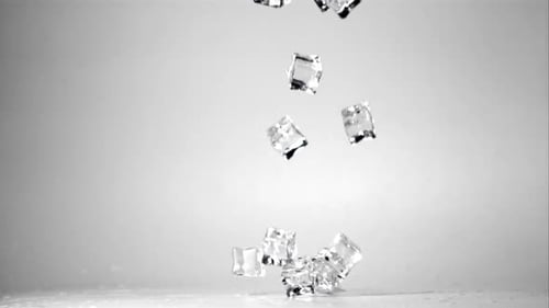 Super Slow Motion Ice Cubes Fall on the Table