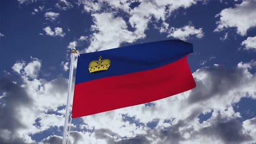 Liechtenstein National Flag Waving in Cloudy Blue Sky
