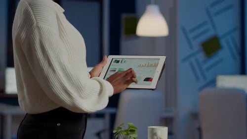 Woman Using Tablet Computer at Office Workplace