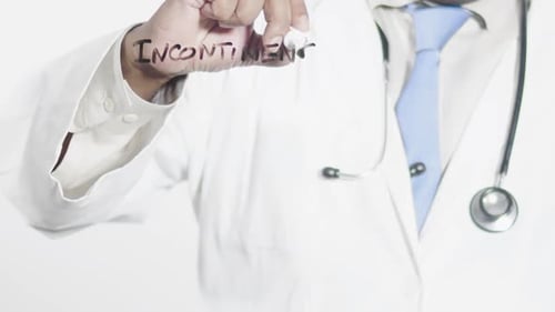 Medical Professional Writing Incontinence with Marker
