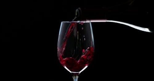 Pouring Red Wine Into a Stemmed Glass