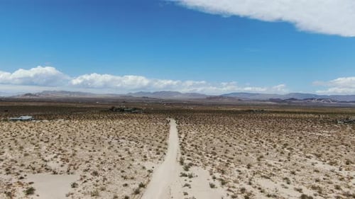 Aerial View of Endless Desert Straight Dust Off Road in Joshua Tree Park. USA