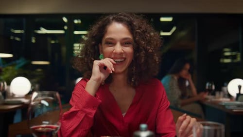 Laughing Woman Looking Camera on Romantic Dinner Date in Fancy Restaurant Cafe