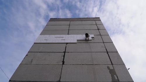 Industrial Climber Insulation of Facade Old High-Rise Building Using Styrofoam