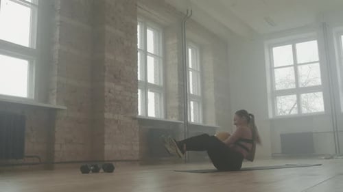 Fit Woman Having Abs Workout Indoors