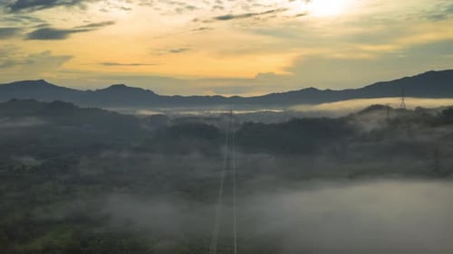 Aerial View of Misty Mountain Landscape at Sunrise