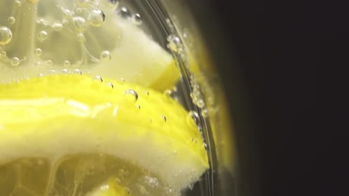 Lemon Slices Floating in Water Close Up