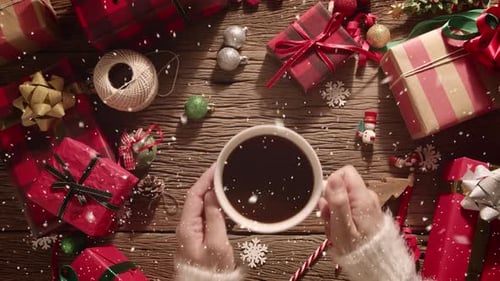 Woman Holding Coffee with Christmas Decorations