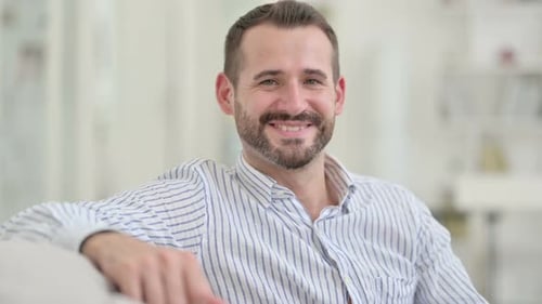 Smiling Man Portrait in Bright Indoor Setting