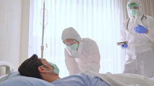 Caucasian doctor and nurse hold flu, measles, coronavirus vaccine shot for diseases in hospital.