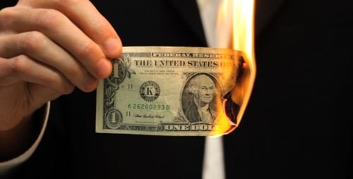 Businessman Burning Dollar