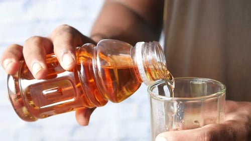 Light Brown Liquid Poured into a Glass