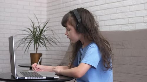 Child Student Learning Online with Laptop at Home