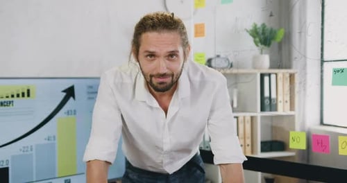 Office Manager which Looking Into Camera with Trustful Face Expression