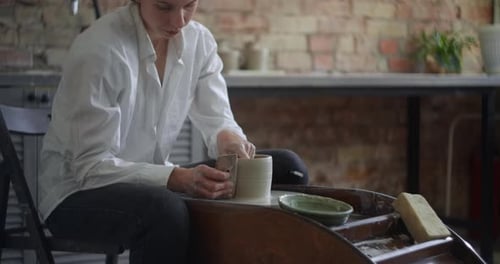 Ceramist Sculpts on a Potter's Wheel Video From Pottery Workshop Potter Makes Ceramics in Slow