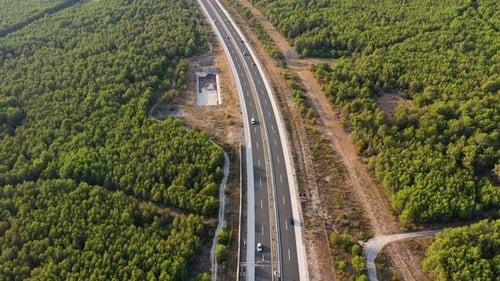 Aerial view on road. Highway through mountain valley. View from a drone.
