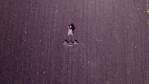 Aerial View of the Tractor Plow a Ground