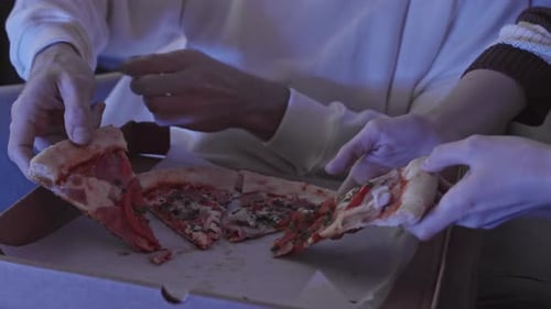 Couple Eating Pizza