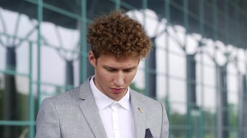 Close Up Face of Handsome Businessman Ceo Executive Finish Phone Call on Mobile Drinking Sipping