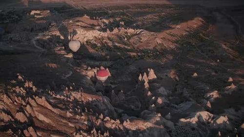 Hot Air Balloons Over Desert at Sunset