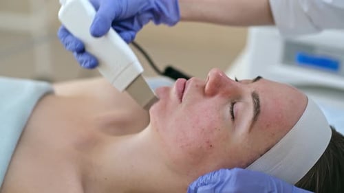 Woman Receiving Facial Treatment in Medical Office