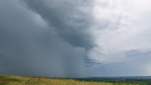 Dark Rain Clouds over Rural Landscape