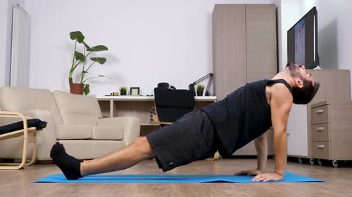 Man Doing Planks in Living Room for Fitness