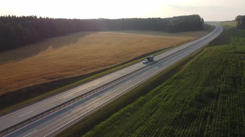 Aerial view of a caravan trailer travelling being towed through the highway.